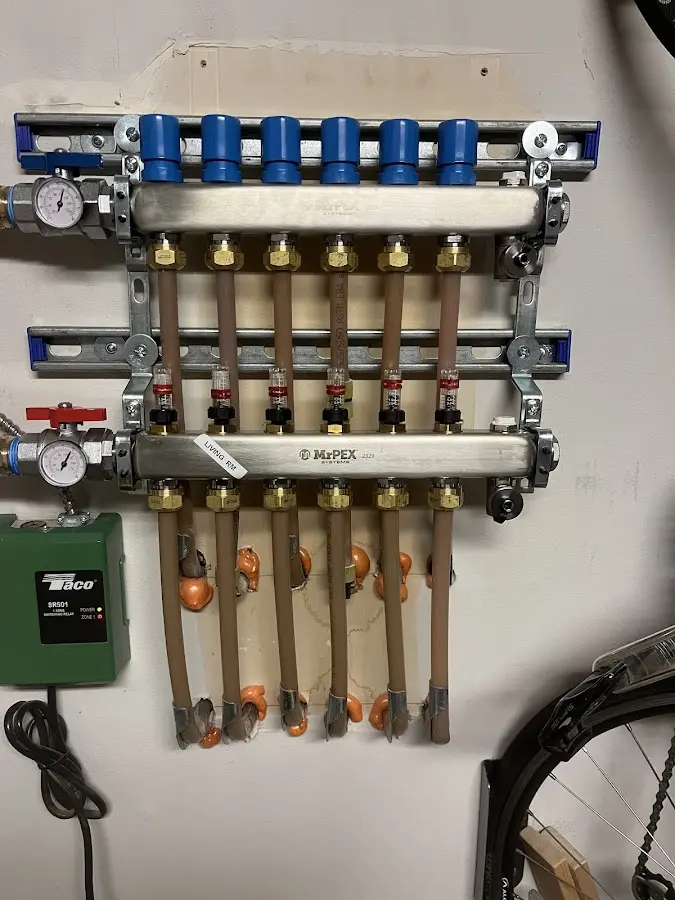 Plumber performing Water Heater Repair at a residential property in Marlboro Village